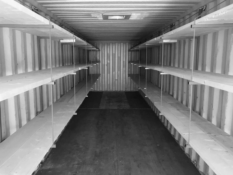 Custom shelving installed inside a shipping container for storage